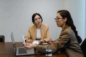 Financial adviser discussing debt review options with a client seeking the best debt review company