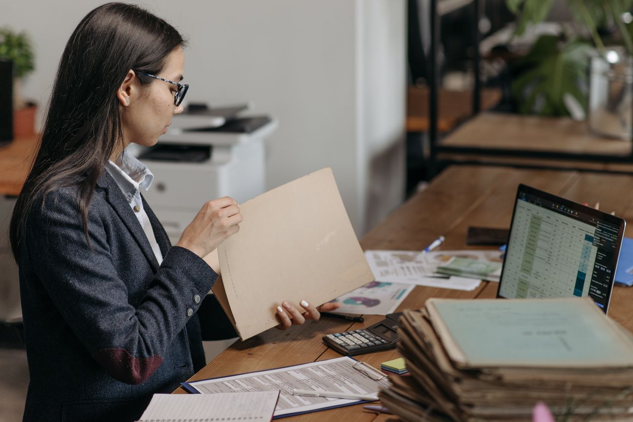 Professional reviewing digital records and document activity